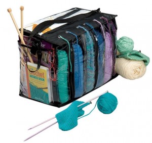The Miles Kimball Knitting Tote Bag is perfect for crochet too! This yarn tote bag features individual, see-through compartments that hold up to 6 skeins. Thread yarn through lid grommets to prevent tangling and fraying. Roomy pockets store hooks, needles, gauges, pattern books, eyeglasses and more. Carrying strap and zip closure too!